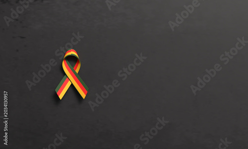 Ribbon bow red yellow orange green color black dark color concrete texture color ribbon bow juneteenth 19 nineteen day date june month america africa history racism peace justic copy space human right