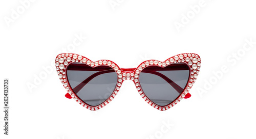 A pair of red cat-eye sunglasses with rhinestones and heart-shaped details are displayed on a white background.