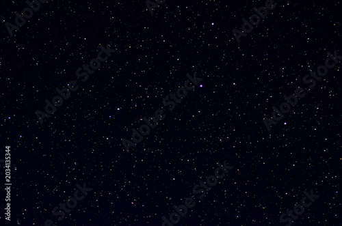 Принти на полотні A beautiful view of a deep dark night sky completely filled with countless bright shining stars