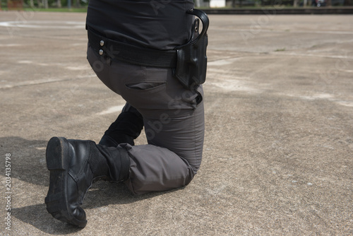 Police tactical firearms pistol training outdoors.	
