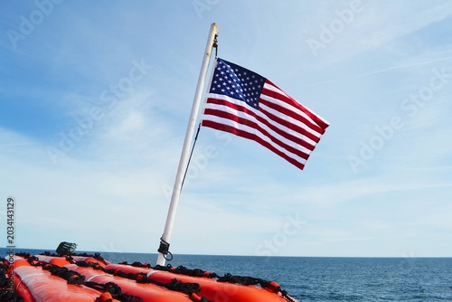Canvas Print An American flag on a dingy boat.