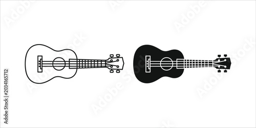 Two acoustic guitars side by side one outlined and one black