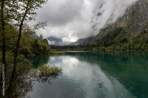 Beautiful alpine landscape with Buclet Lake under a cloudy sky in the French Alps, Isère
