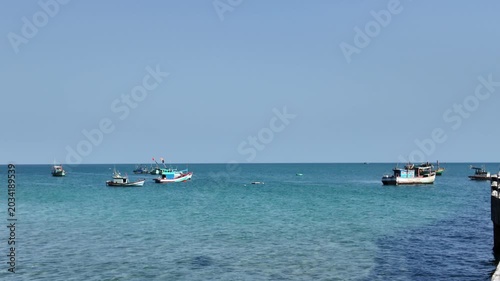 Traditional Fishing Boats Anchored in Calm Turquoise Ocean Water