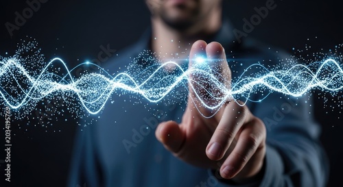 Man interacting with a futuristic digital waveform on a dark background with glowing blue particles and lines