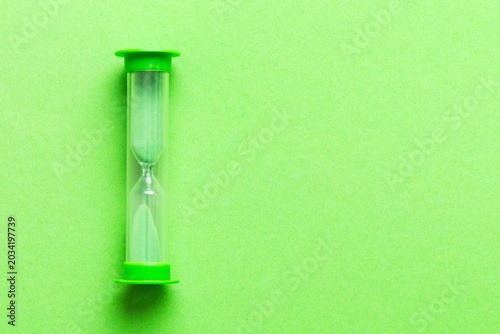 hourglass on the table, sand clock as time passing concept for business deadline, copy space