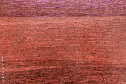 Photo of mahogany mahogany texture.A red wooden background for the text.Rowan-colored furniture.
