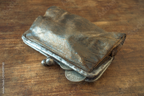 Obraz na plátně An old purse with silver coins