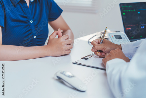 Canvastavla Doctor examining patient symptoms, providing healthcare advice in office, discus