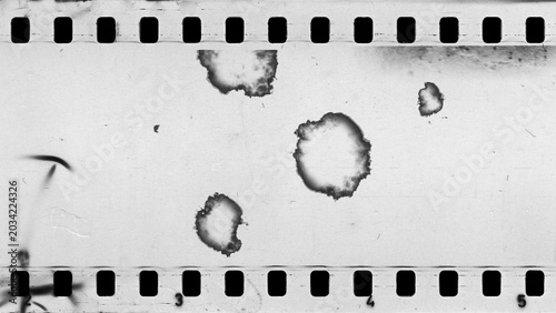 Fényképezés Damaged an old celluloid film strip with dust and scratches