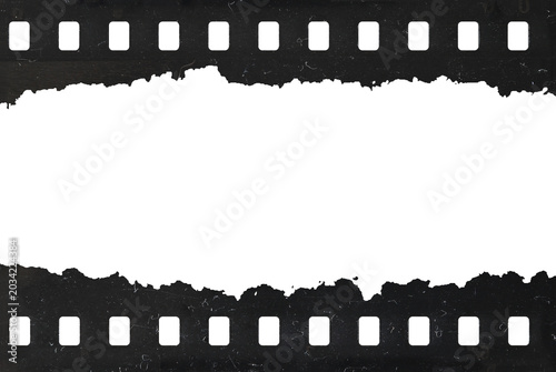 Tattered celluloid filmstrip with natural rough dust and scratches