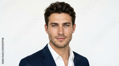 A man in a suit against a white background.