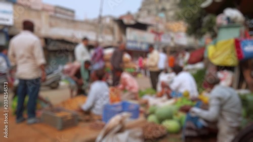 Bokeh view of vegetable market in Varanasi, India. Blurred background footage.