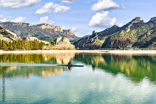 Tableau sur toile Man kayaking on the reservoir in the Sant Llorenç de Montgai Natural Park, Noguera region, Lleida, Catalonia