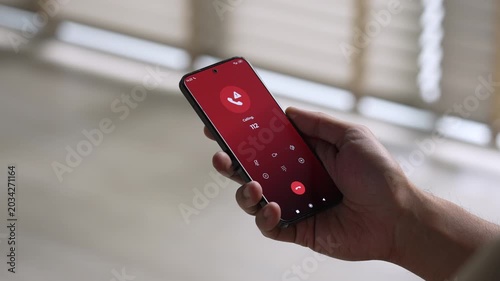 Man calling emergency number 112 for crisis situation