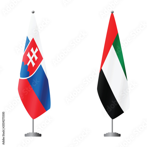 Photography Slovakia and United Arab Emirates flags on flagpoles for official ceremonies and