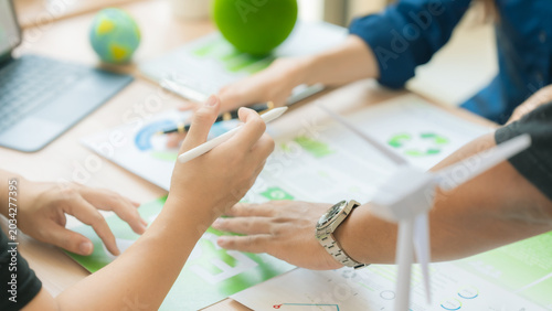 The business team is discussing ESG concepts and sustainability in the office.
Professional colleagues are planning a green business strategy using ESG investment criteria.
(Close-up view)