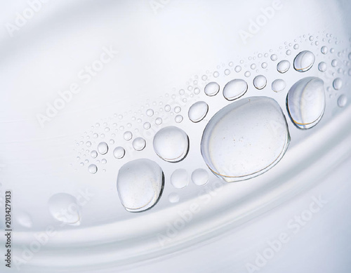 Close-up of Water Droplets on a White Surface, Abstract Background.