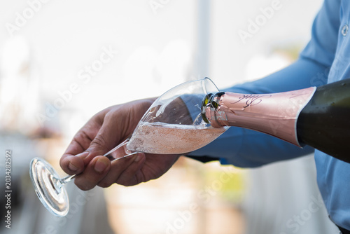 opening a bottle of champagne