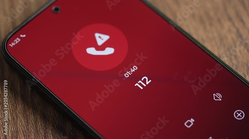 Close-up smartphone showing Emergency calling number 112 on the screen