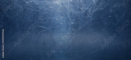 Grunge abstract blue background of crinkled cellophane with scratches, transparent layers, rough texture, horror style, copy space for design.