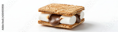 toasted marshmallow chocolate gooey center sits atop flat white surface soft diffused studio lighting highlights textures