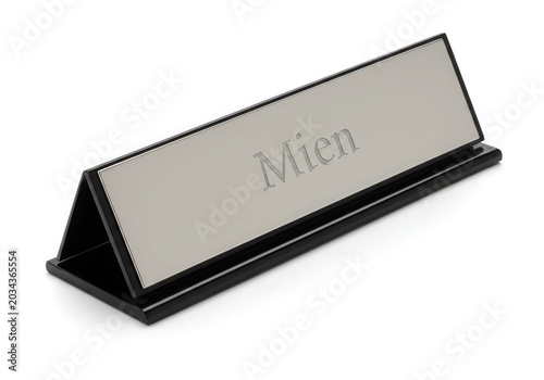 a desk name plate with engraved silver text