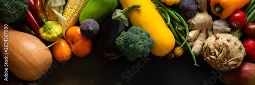 Konstfotografi Fresh vegetables and fruits fill a surface after being gathered from the garden,