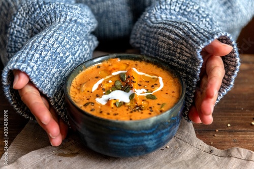 Fotografija Cozy soup in blue bowl.