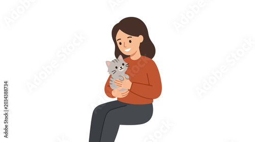 Obraz na płótnie A young woman holding a small kitten with care.