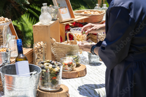 Rustic Gourmet Snack Table with Olives and Appetizers at Outdoor Event