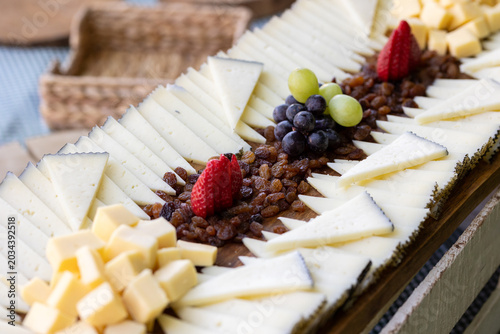 Artisan Cheese Platter with Grapes, Raisins and Strawberries for Gourmet Catering