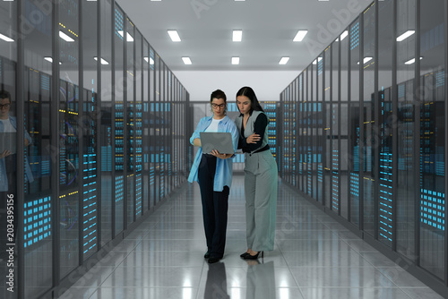 Technology specialists analyzing network operations inside a 3D data center