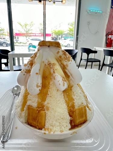 Gourmet Korean Bingsu Shaved Ice Dessert with Cream and Caramel