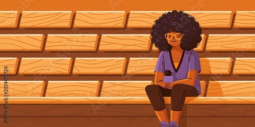 Reporter sitting in bleachers alone