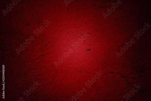 Dark red textured background with rough grunge finish. Ideal for dramatic backgrounds and intense designs.
