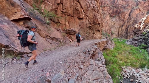 Couple Backpacks into the Grand Canyon on the North Kaibab Trail in Summer