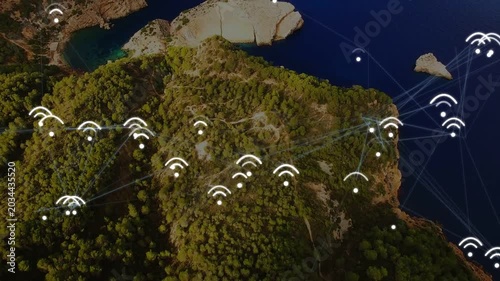 Forested headland forming network after pulses, nodes glowing and linking seaward, mapping flow