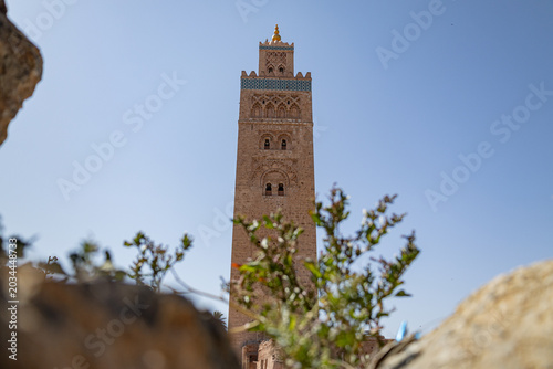 Famous Koutoubia Mosque minaret tower rising into a blue sky in Marrakech, Morocco