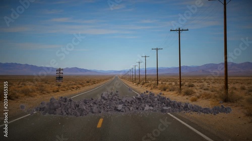 Ground explosion on asphalt desert highway