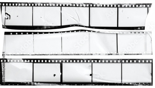 Vintage Damaged Black And White Film Strips With Perforations On White Background