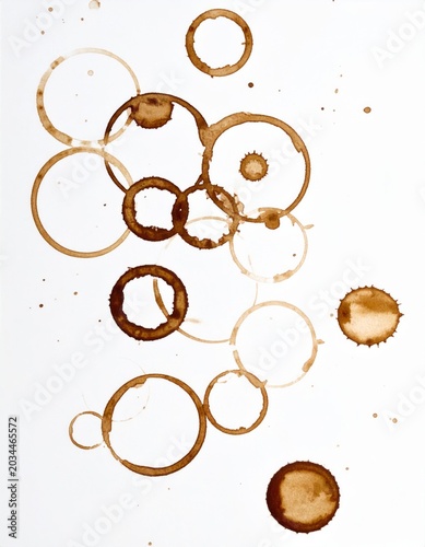 Irregular Brown Coffee Rings Scattered on a Clean White Background