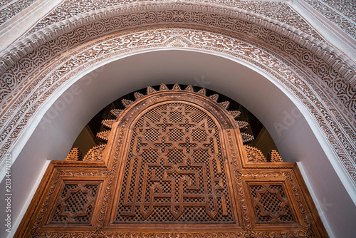 Traditional Moroccan geometric patterns and Islamic ornament details creating luxurious abstract architectural background textures.