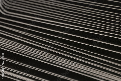 Konstfotografi black cardboard boxes with semicircular corners folded together, close up