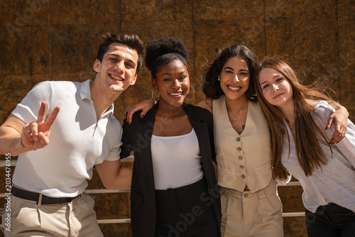 Konstfotografi Diverse friends hugging and smiling expressing unity and togetherness