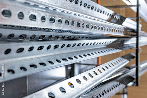 Obraz na plátně Close-up horizontal view of galvanized steel slotted strut channels and perforat