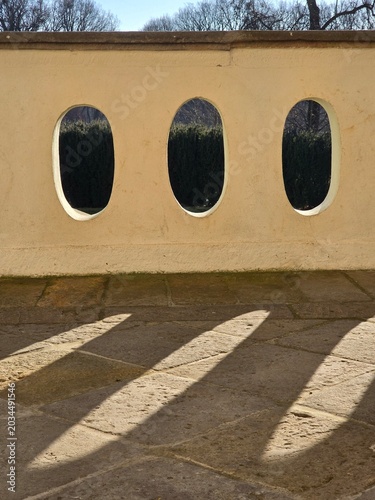 Architectural detail of a historic balustrade with shadows