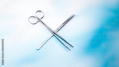 Stainless steel surgical scissors and forceps arranged on a sterile blue surface, clean and ready for use in modern healthcare, surgery, and clinical treatment settings