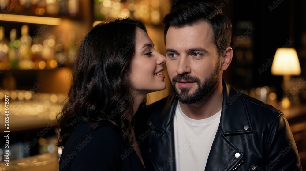 Naklejka premium Woman whispering secret to man at bar. Couple flirting in restaurant. Romantic mood, close communication and intimacy. Dating concept, night life, love, relationship and social interaction