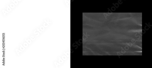 Tableau sur toile Crumpled plastic wrap texture on black background, transparent cling film overla